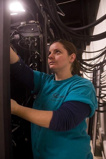 audio visual consultant working on audio rack